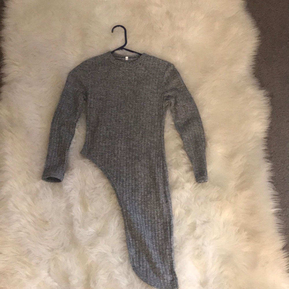 Grey sweater that has the side out